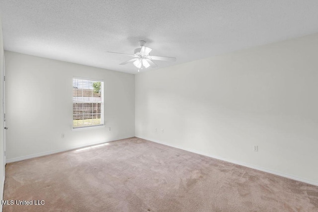 14196 Maple Ct, Gulfport, MS 39503 - empty room featuring ceiling fan, carpet floors, baseboards, and a textured ceiling