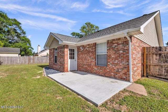 14196 Maple Ct, Gulfport, MS 39503 - rear view of property featuring brick siding, a patio, and a shingled roof