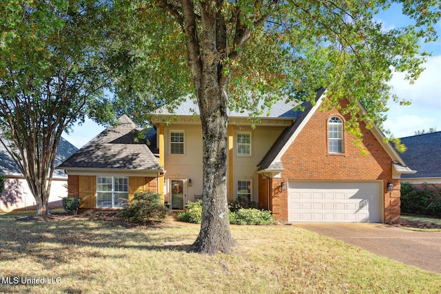 view of front facade with a garage and a front yard