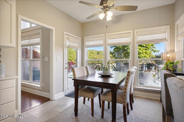 dining room featuring light hardwood / wood-style flooring and ceiling fan