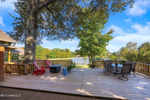 deck featuring a water view