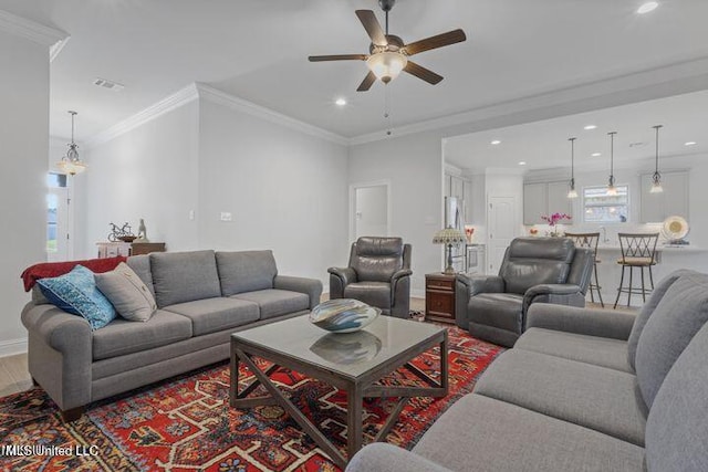 living room featuring ornamental molding, recessed lighting, wood finished floors, and a ceiling fan