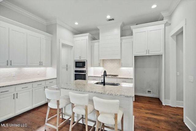 kitchen with sink, stainless steel appliances, and white cabinets