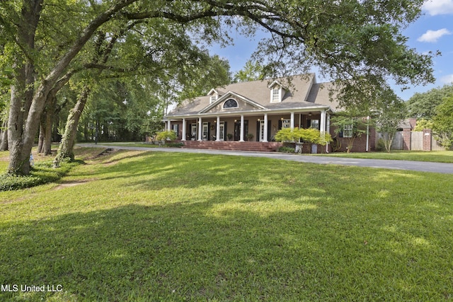 6 N Hill Dr, Carriere, MS 39426 - view of front of property featuring covered porch and a front lawn