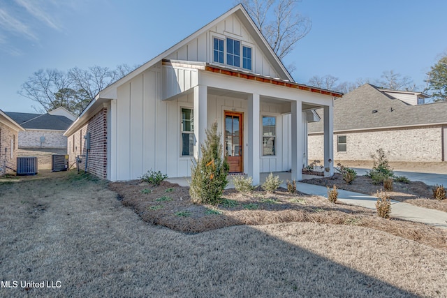 603 Cobalt Way, Brandon, MS 39042 - view of front facade featuring board and batten siding, a porch, and central AC