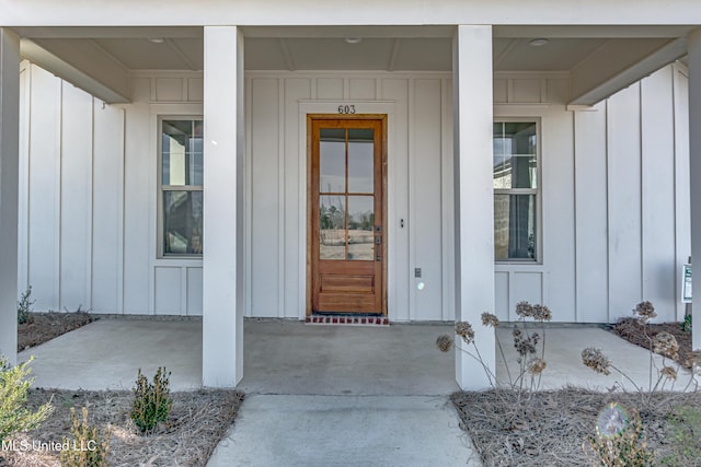 603 Cobalt Way, Brandon, MS 39042 - view of exterior entry featuring a porch and board and batten siding