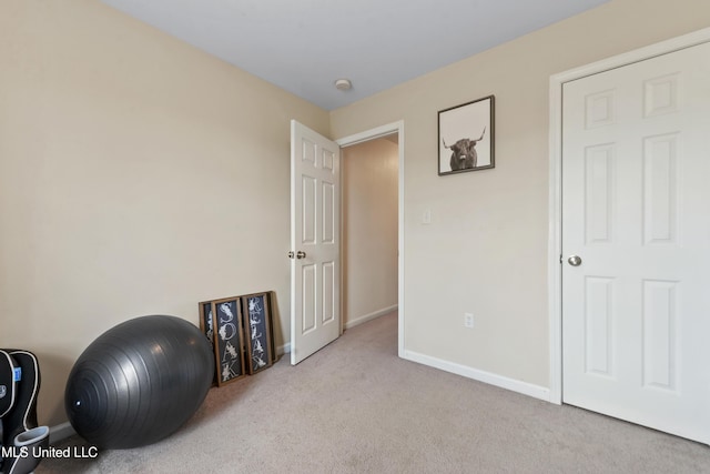 2301 Paula Cir, Ocean Springs, MS 39564 - workout room with baseboards and carpet flooring