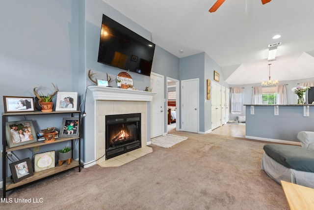2301 Paula Cir, Ocean Springs, MS 39564 - carpeted living area with a tile fireplace, ceiling fan, a chandelier, and recessed lighting