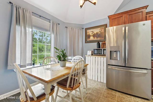 2301 Paula Cir, Ocean Springs, MS 39564 - dining room featuring vaulted ceiling and light tile patterned flooring