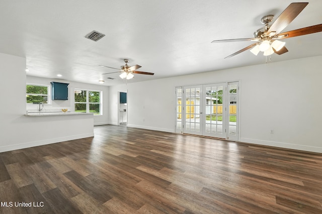 611 E E Lakeshore Dr, Carriere, MS 39426 - unfurnished living room with a ceiling fan and dark wood-style floors