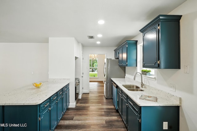 611 E E Lakeshore Dr, Carriere, MS 39426 - kitchen featuring dark wood-type flooring, recessed lighting, dishwasher, a peninsula, and light stone counters