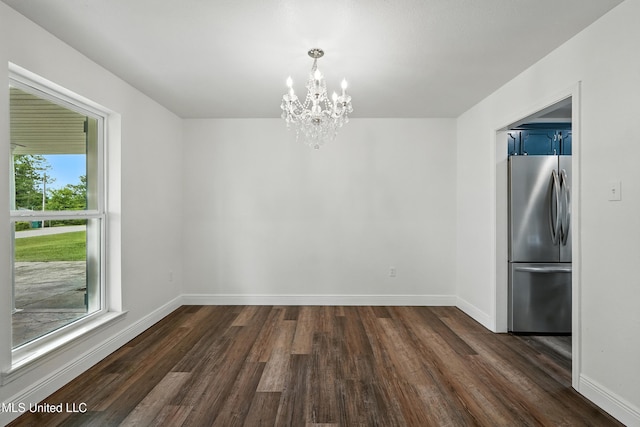 611 E E Lakeshore Dr, Carriere, MS 39426 - unfurnished dining area featuring healthy amount of natural light, a chandelier, and dark wood-style floors