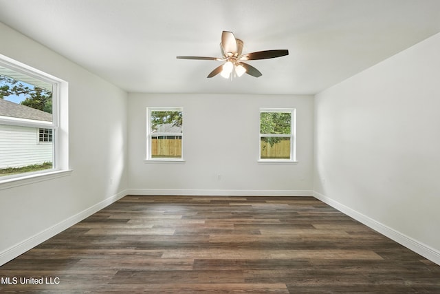 611 E E Lakeshore Dr, Carriere, MS 39426 - spare room featuring healthy amount of natural light, ceiling fan, and dark wood finished floors