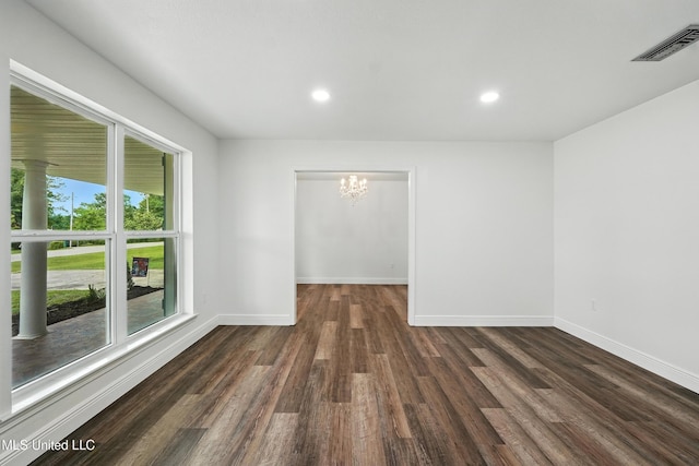 611 E E Lakeshore Dr, Carriere, MS 39426 - unfurnished room featuring a chandelier, dark wood-type flooring, and recessed lighting