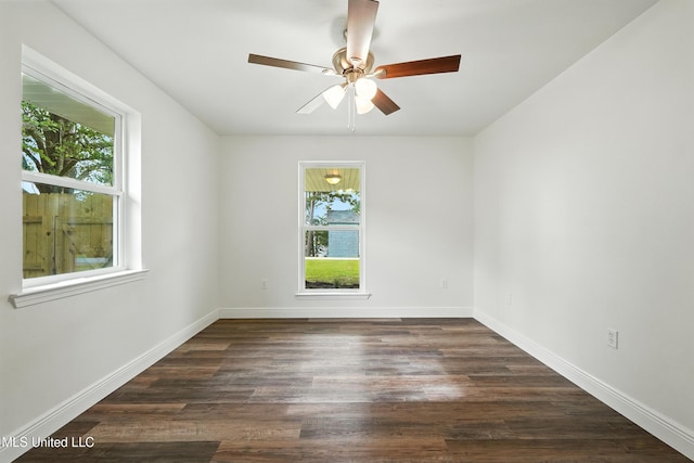 611 E E Lakeshore Dr, Carriere, MS 39426 - spare room with healthy amount of natural light, a ceiling fan, and dark wood-style floors
