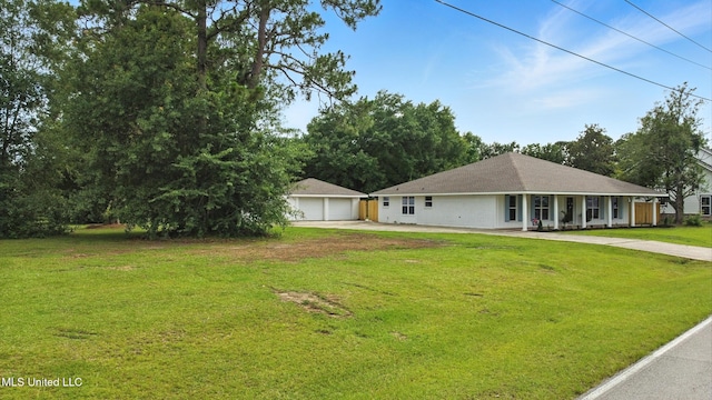 611 E E Lakeshore Dr, Carriere, MS 39426 - view of front facade featuring a detached garage, a front lawn, and an outdoor structure