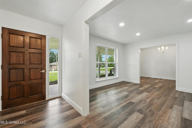 611 E E Lakeshore Dr, Carriere, MS 39426 - entryway with a chandelier, healthy amount of natural light, dark wood-style flooring, and recessed lighting