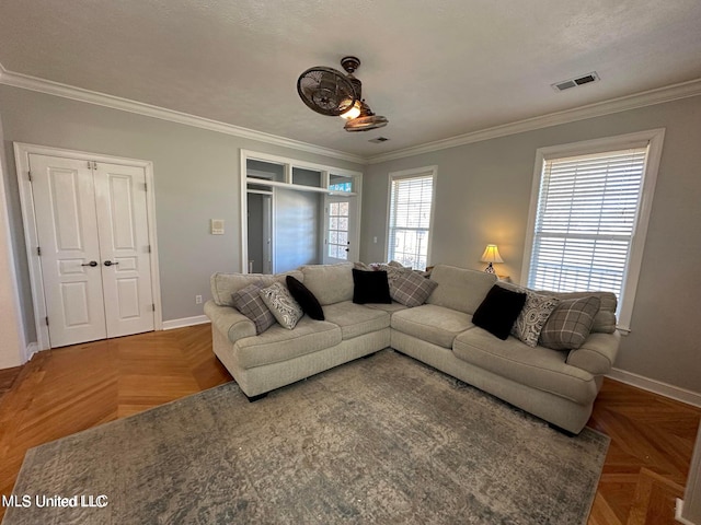 living room with a textured ceiling, parquet floors, and crown molding