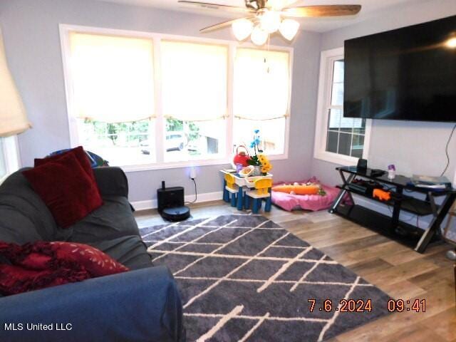 recreation room with hardwood / wood-style floors and ceiling fan