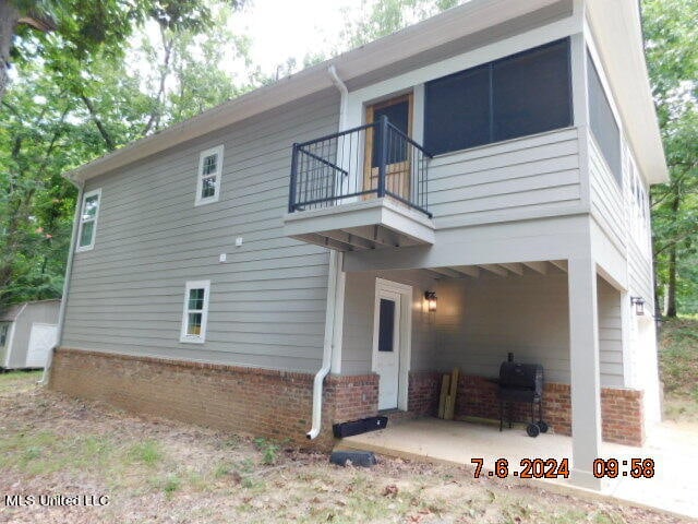 exterior space featuring a patio area and a balcony