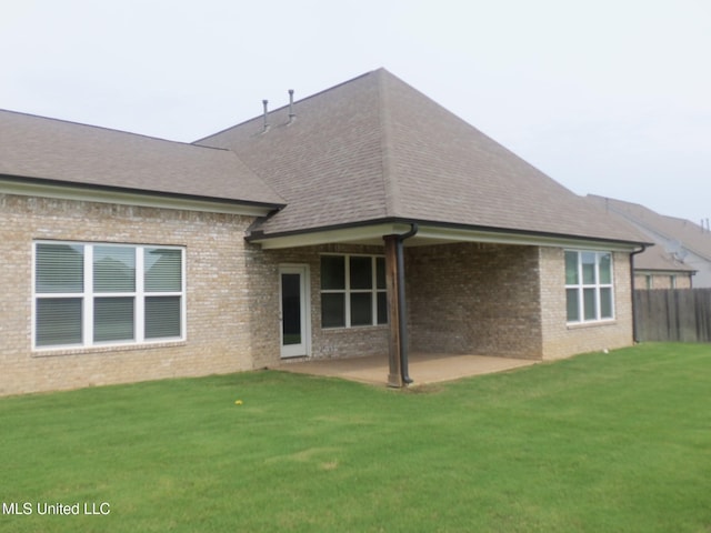 7156 Edgewater Dr, Olive Branch, MS 38654 - rear view of house featuring brick siding, a patio area, and a shingled roof