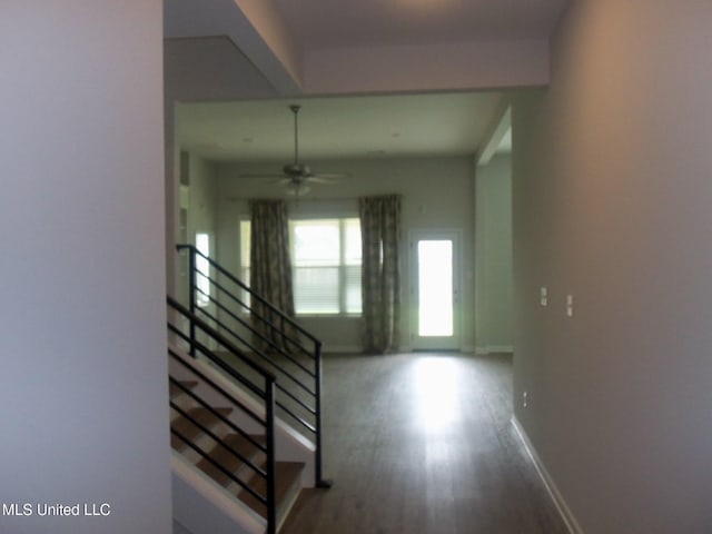 7156 Edgewater Dr, Olive Branch, MS 38654 - hall with wood finished floors, baseboards, and stairs
