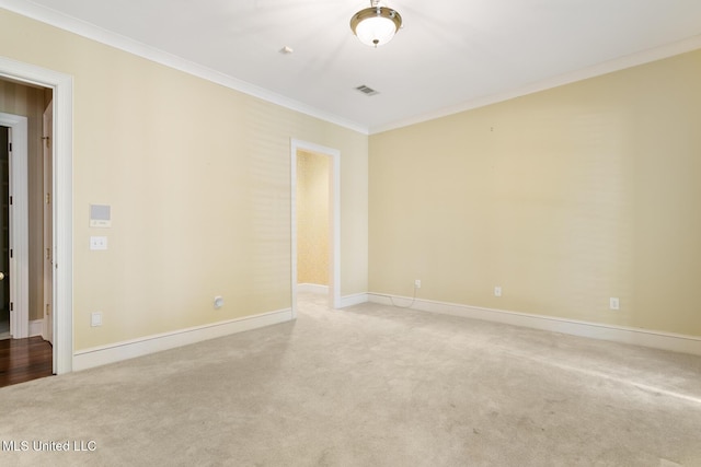 empty room with light carpet and ornamental molding