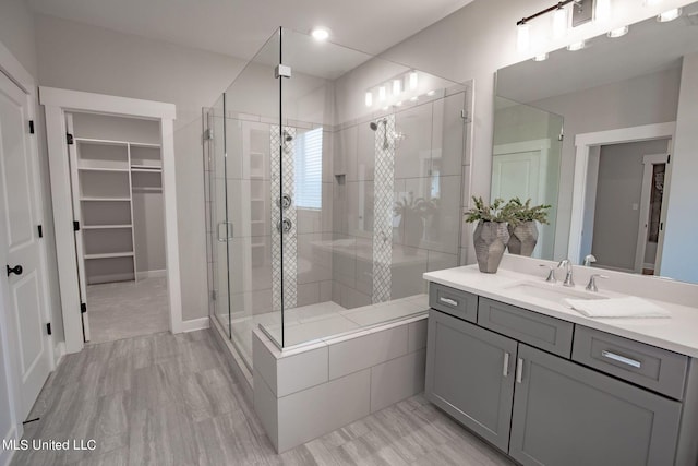 bathroom with vanity and walk in shower