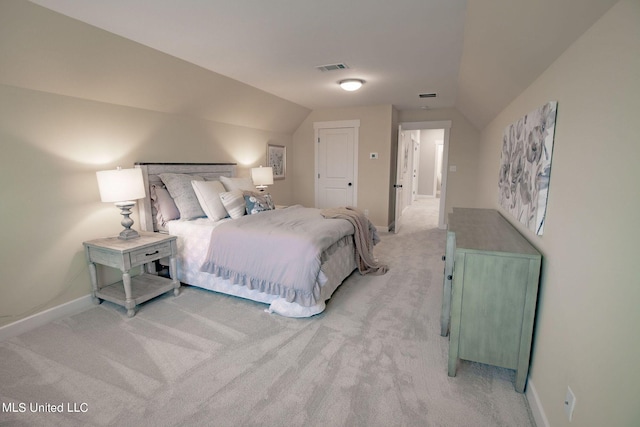 carpeted bedroom featuring vaulted ceiling