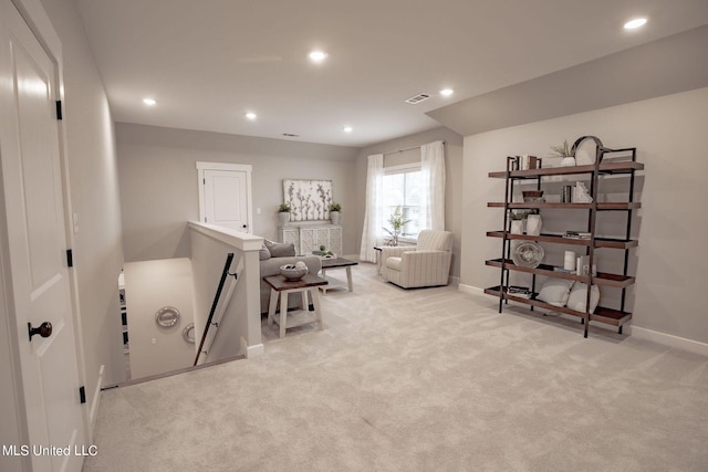 living area with light colored carpet