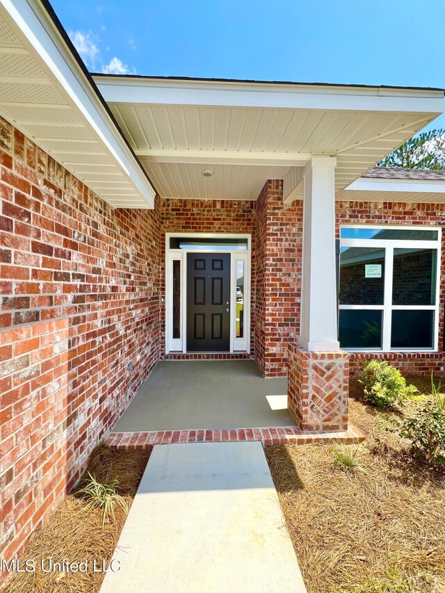15693 Perdido Dr, Gulfport, MS 39503 - entrance to property with a porch and brick siding
