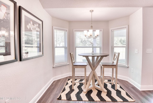 15693 Perdido Dr, Gulfport, MS 39503 - dining area featuring dark wood-type flooring and plenty of natural light