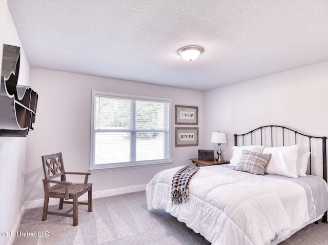 15693 Perdido Dr, Gulfport, MS 39503 - carpeted bedroom featuring baseboards and a textured ceiling