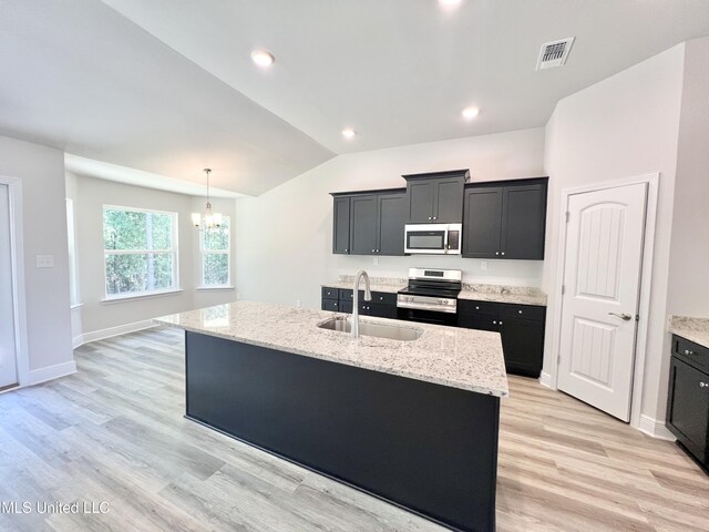 15693 Perdido Dr, Gulfport, MS 39503 - kitchen featuring a sink, an inviting chandelier, dark cabinetry, stainless steel appliances, and visible vents