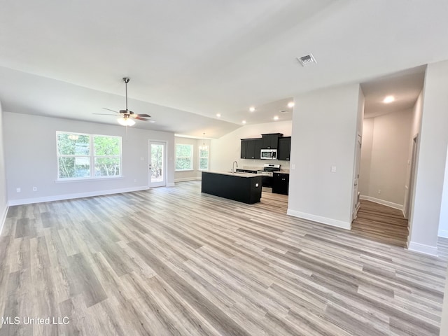 15693 Perdido Dr, Gulfport, MS 39503 - unfurnished living room featuring recessed lighting, light wood finished floors, baseboards, and a ceiling fan