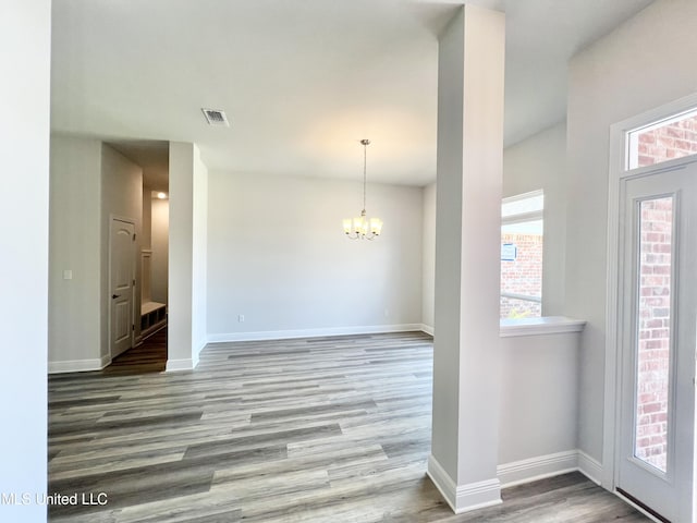 15693 Perdido Dr, Gulfport, MS 39503 - entrance foyer with baseboards, wood finished floors, a chandelier, and visible vents