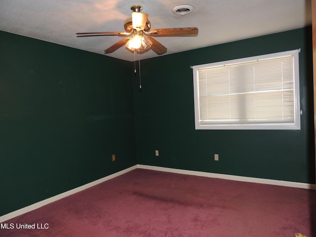 empty room featuring ceiling fan and carpet flooring