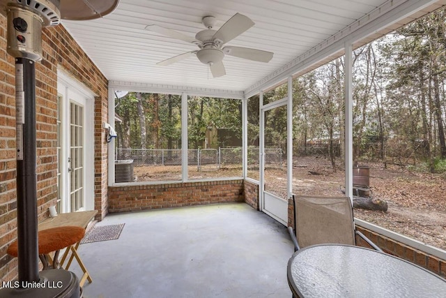 sunroom with plenty of natural light and ceiling fan