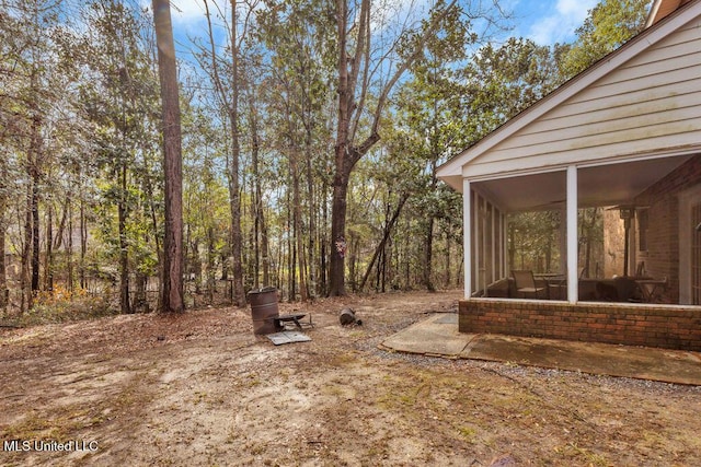 view of yard with a sunroom