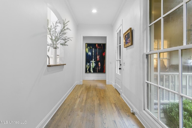 3844 Hawthorn Dr, Jackson, MS 39216 - hallway featuring recessed lighting, baseboards, crown molding, wood finished floors, and arched walkways