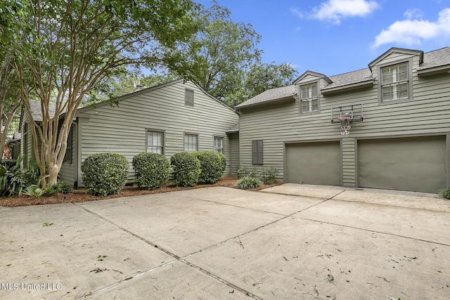 3844 Hawthorn Dr, Jackson, MS 39216 - view of front of property with a shingled roof, driveway, and a garage