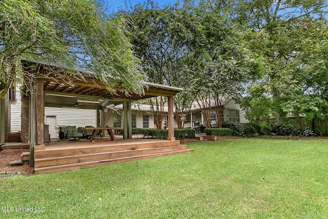 view of yard featuring a wooden deck