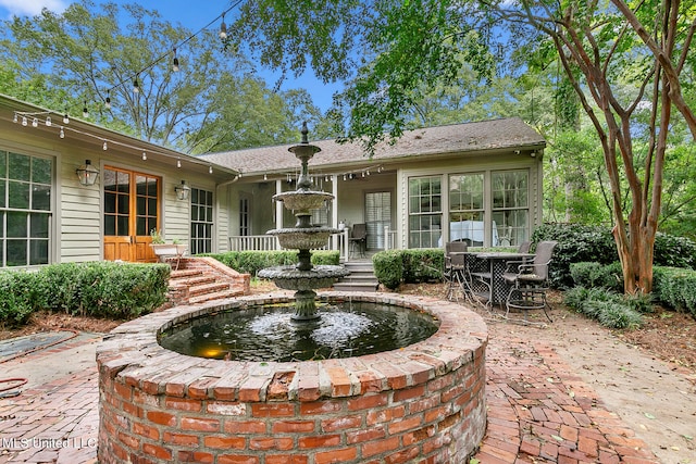 rear view of house with a patio area