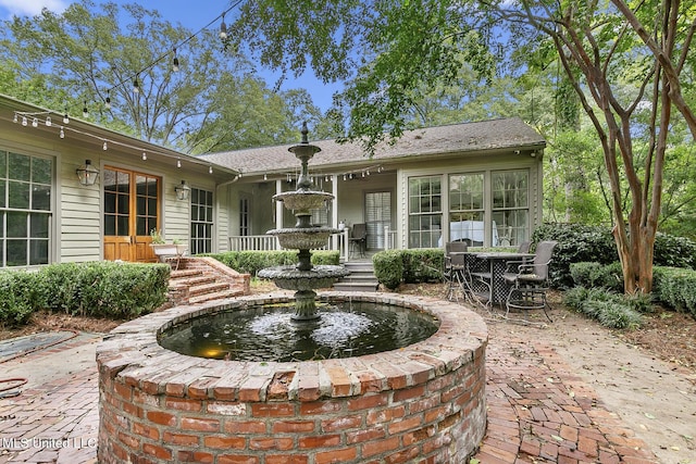 3844 Hawthorn Dr, Jackson, MS 39216 - rear view of house with a patio area