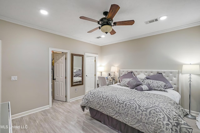 bedroom with light hardwood / wood-style floors, ceiling fan, and crown molding