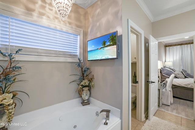 bathroom with an inviting chandelier, tile patterned floors, a tub to relax in, toilet, and ornamental molding