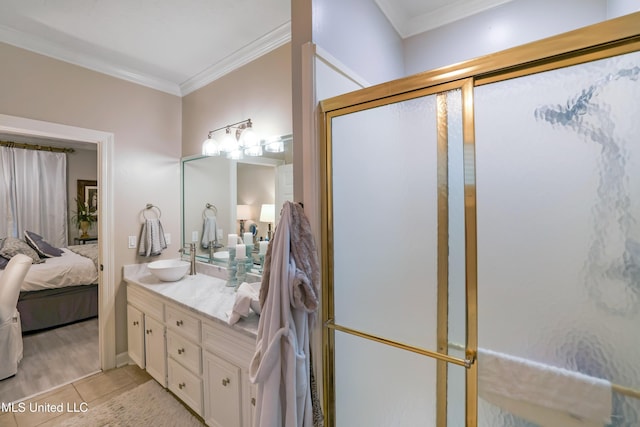 bathroom with tile patterned flooring, vanity, ornamental molding, and walk in shower