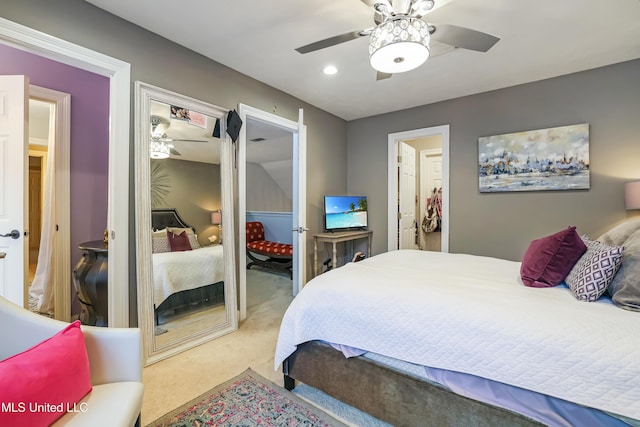 bedroom featuring ceiling fan and light colored carpet