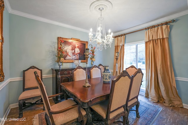 dining room featuring crown molding, dark hardwood / wood-style flooring, and a notable chandelier