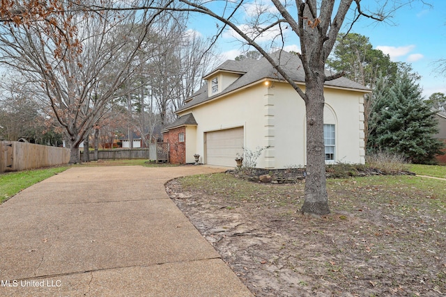 view of side of property with a garage